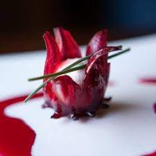 Goat Cheese Nestled In A Wild Hibiscus Flower With Chive Edible Flowers Recipes Flower Food Food