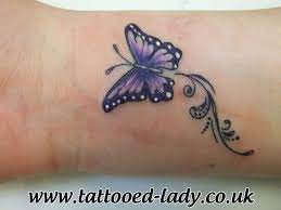 Small Purple Butterfly Tattoo On Wrist One Of A Cpl Together Different Colors Butterfly Tattoos For Women Purple Butterfly Tattoo Butterfly Wrist Tattoo