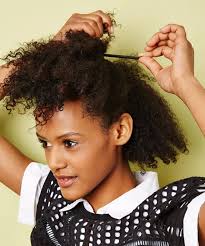 Braid your hair in a few cornrows, leaving the ends loose. Easy Natural Hairstyles For Transitioning Hair