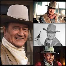 Actors John Wayne (right) as Rooster Cogburn and Glen Campbell as La Boeuf  in a scene from the western 'True Grit', 1969