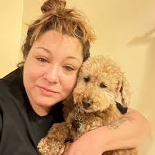 Will getting another doodle help with anxiety in my current dog?