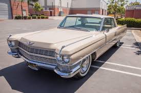 Portrait of jesus above his left biceps, he thinks his right arm is a good luck arm. Travis Barker Is Selling His Gorgeous 1964 Cadillac Coupe Deville Autoevolution
