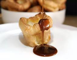 Yorkshire Pudding Drenched In Rich Onion Gravy Recipe Yorkshire Pudding Yorkshire Pudding Recipes Onion Gravy