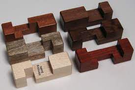 A pyramid puzzle consists of two or more component pieces which fit together to create a pyramid. Simple 6 Piece 6 Solutions Burr Set Copyright J A Storer