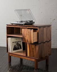 I was inspired to design a coffee table with real turntables under it. Record Player Table