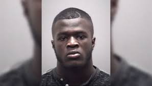 Third football player charged with secret peeping