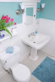 A contemporary bathroom with a turquoise tile statement wall in the shower for a wow effect. Selling Or Renovating Blue Bathrooms Like These Sell For More Bucks