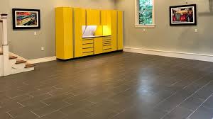 Which garage floor tile will form a stronger floor that won't shift or split apart? Porcelain Tile The Ideal Surface For Garage Flooring Garage Floor Flooring Wood Floor Design
