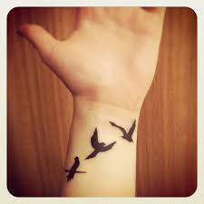 Birds are not only adorable creatures but are also filled with diverse meanings and symbolism. Flying Away Bird Tattoo Small Wrist Tattoos Cool Wrist Tattoos Wrist Tattoos For Women