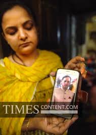 Murder Case News Photo A relative showing a picture of ...