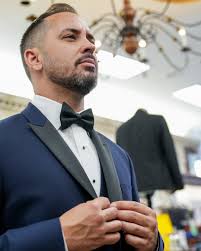 Confidence isn't loud. It's styled like this. White tux, cheetah bow,  Biltmore touch.