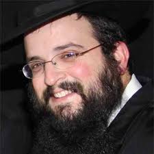 Look past the beard and black hat — you'll see a rainbow