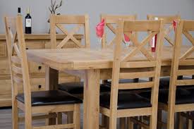 The leg frame recalls that of a refectory table and includes a brushed brass detail on the cross beam. Canterbury Oak 180 260 Extending Dining Table Free Delivery