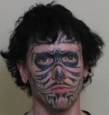 A scary face tattoo design showing on side back. Photos Top 20 Scariest Face Tattoo Mugshots News Blog