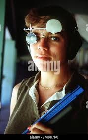 U.S. Marine Corps Warrant Officer Seth Smith and Cpl. Jesse Cobos compete  in a tire flipping challenge during a Security Battalion field meet
