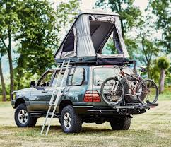 The toyota landcruiser has a strong engine capacity ready to take you anywhere even without engaging the 4×4 though these car book the land cruiser with double roof top tent to enjoy safari tours in rwanda with friends and family on vacation tour. James Baroud Discovery Rooftop Tent Adventure Ready Roof Top Tent Toyota Land Cruiser 100 Toyota Land Cruiser