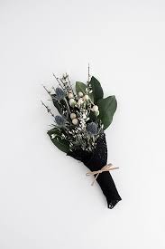 To tailor the tissue paper a bit more to the flowers, cut a straight at least 1 inch from the bottom of the stems and finish the diamond shape, matching the left side by cutting a diagonal. 3 Easy Ways To Wrap Flowers Homey Oh My