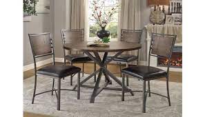 We designed this industrial dining table by drawing on manufacturing themes from the machine age of the early 1900s. Sledo Industrial Round Dining Table Set