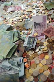 A small rectangular shaped card that is issued to a cardholder for the use of purchasing goods using a credit account, the card holding information on a magnetic strip. Pay With Credit Cards Or Cash By Rick Steves