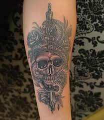 Skull Bite The Bullet Tattoo 150 Sword Tattoos And Their Meaning Sword Tattoo Arm Tattoos For Women Arm Tattoos For Women Forearm