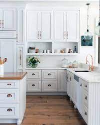 As you can see above there are 2 different size handles on our cabinets so we started with the pulls on the glass cabinets which were placed 8″ from the bottom of the door to the bottom of the hardware. Top 70 Best Kitchen Cabinet Hardware Ideas Knob And Pull Designs