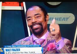 Nets superstar sails for an easy layup against Clyde Frazier of the  Knicks...