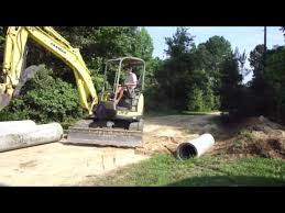 Build a country driveway from scratch with careful planning taking into account traffic safety, visibility, driveability, drainage, and surface materials. Installing A Driveway Culvert Youtube