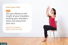 Woman Doing Chair Eagle Pose Chair Pose Yoga Yoga Poses Chair Yoga