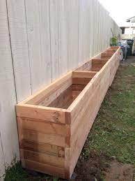 Planters and flower pots are good introductions to gardening, but a great way to grow fresh edibles with limited space is with a diy raised garden bed. Patio Ideas 2x4 Planter Box Our Backyard Is Narrow So We Want To Take Advantage Of Wooden Patio Plan Diy Garden Fence Diy Raised Garden Garden Beds Along Fence
