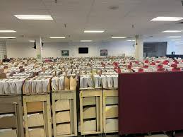 Photo: IRS Office Full of Paper, Unprocessed Tax Returns and Refunds