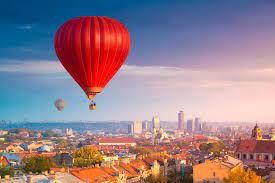 Multicolored, large balloons against the blue sky. Float Over Vilnius In A Hot Air Balloon Radisson Blu