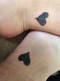 A tattoo is a form of body modification made by inserting ink, dyes, and/or pigments, either indelible or temporary, into the dermis layer of the skin to form a design. Thumb Print Heart Tattoo Blurmark