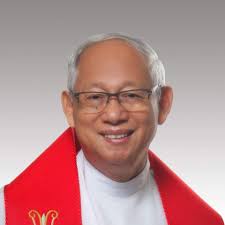 Monsignor Manny Gabriel added a...