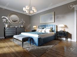 These dramatic navy blue suites are seriously stylish. A Modern Bedroom In An Eclectic Style With A Double Blue Bed Stock Photo Picture And Royalty Free Image Image 148920829