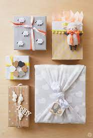 We've got you covered from unique baby shower gifts to baby shower gift baskets. Baby Gift Wrap Ideas Showered With Love Think Make Share Creative Gift Wrapping Baby Gift Wrapping Gift Wrapping