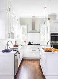 Beautiful white cabinetry is what makes this modern farmhouse kitchen by meagan rae interiors feel fresh, clean, and sparkling. High Ceiling With Tall Cabinets Transitional Kitchen New York By Think Chic Interiors Houzz