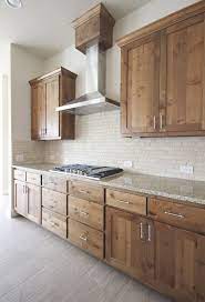 Rustic alder kitchen cabinets have an overall appearance that is characterized by a dramatic uniform graining pattern. Modern Kitchen With Wood Knotty Alder Cabinetry Galleykitchen Alder Kitchen Cabinets Rustic Modern Kitchen Rustic Kitchen