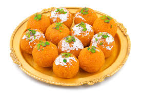 Motichoor Laddus, small round orange sweet balls made from tiny gram flour droplets, served in a bowl