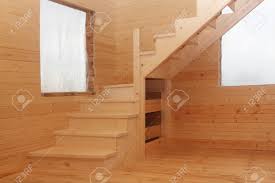 These compact wooden stairs spiral up around a black pole that you can hang onto as you climb. Wooden Loft Stairs In The Timber House Corner Under Conctruction Stock Photo Picture And Royalty Free Image Image 21432142