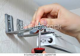 I've had my blinds a long time and when i broke the clips during a recent cleaning, i was worried that it would be difficult to replace and. Vertical Blinds Mounting Brackets Hand With A Screw Close Up Mounting Vertical Blinds Vertical Blinds Outside Mount Canstock