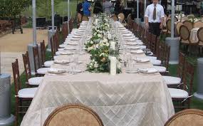 This Outdoor Event Has A Table Setting Featuring 8 Foot Banquet Tables Dressed In Ivory Pintuck Linen And Lined With Fruitwoo Banquet Tables Event Rental Event