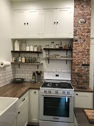 See all the little details of this stunning tudor revival kitchen remodel. Old House Kitchen Remodel With Blue Pine Raw Edge Shelves Exposed Brick Chimney And Butcher Block Kitchen Remodel Small Kitchen Design Exposed Brick Kitchen
