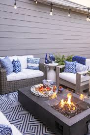 Give your outdoor space a living room vibe with the addition of a mirror. Patio Makeover With Frontgate Blue Patio Decor Outdoor Patio Decor Blue Patio Furniture