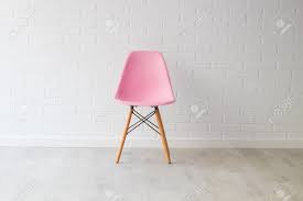 Create an inviting atmosphere with new living room chairs. Modern Pink Chair In Background And White Decor Stock Photo Picture And Royalty Free Image Image 117282066