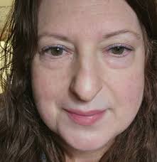 Person with hazel-green eyes shares eye color information