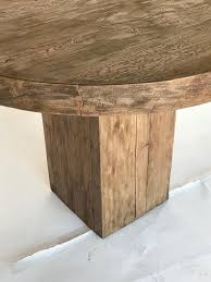 Designed by komplot design in 2013, the gubi dining tables have a traditional scandinavian design aesthetic, with their wooden base matching their table top and their simple yet soft lines. Custom Rustic Modern Round Table With Square Base For Sale At 1stdibs