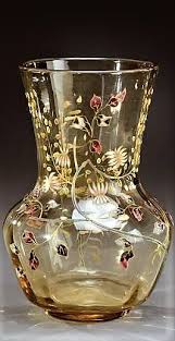 Emile Galle 1846 1904 Vase En Verre Legerement Teinte Brun A Panse Bombee Et Col Droit Evase A Decor Emaille De Motifs Flo Lalique Antique Vase Antique Glass
