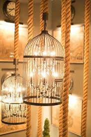 Hanging Bird Cage Decor Ideas Love Hanging A Birdcage Around A Chandelier As Long As Someone Else Dusts Says Http Howtoconsign Co Birdcage Chandelier Beautiful Chandelier Bird Cage Decor
