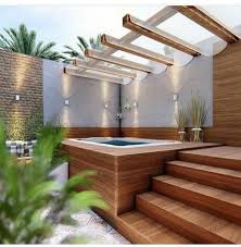 Spa Jacuzzi 12 Idees Pour Lintegrer Dans Son Jardin Terrasse En Bois Entourant Un Spa The Post Spa Jacuzzi 12 Hinterhof Wandbeleuchtung Gartengestaltung