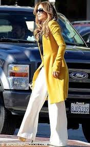 Keen As Mustard Yellow Clad J Lo Leads The Way As The American Idol Judges Head Classy Winter Outfits Yellow Clothes Classy Winter
